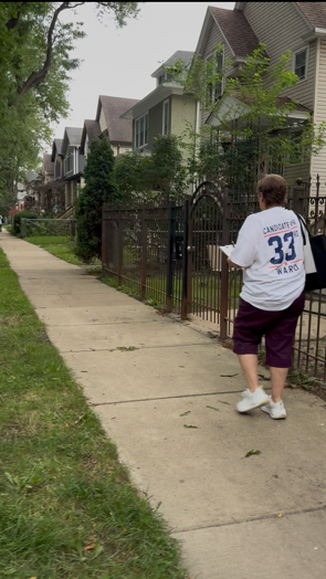 Maria walking to meet with neighbors.